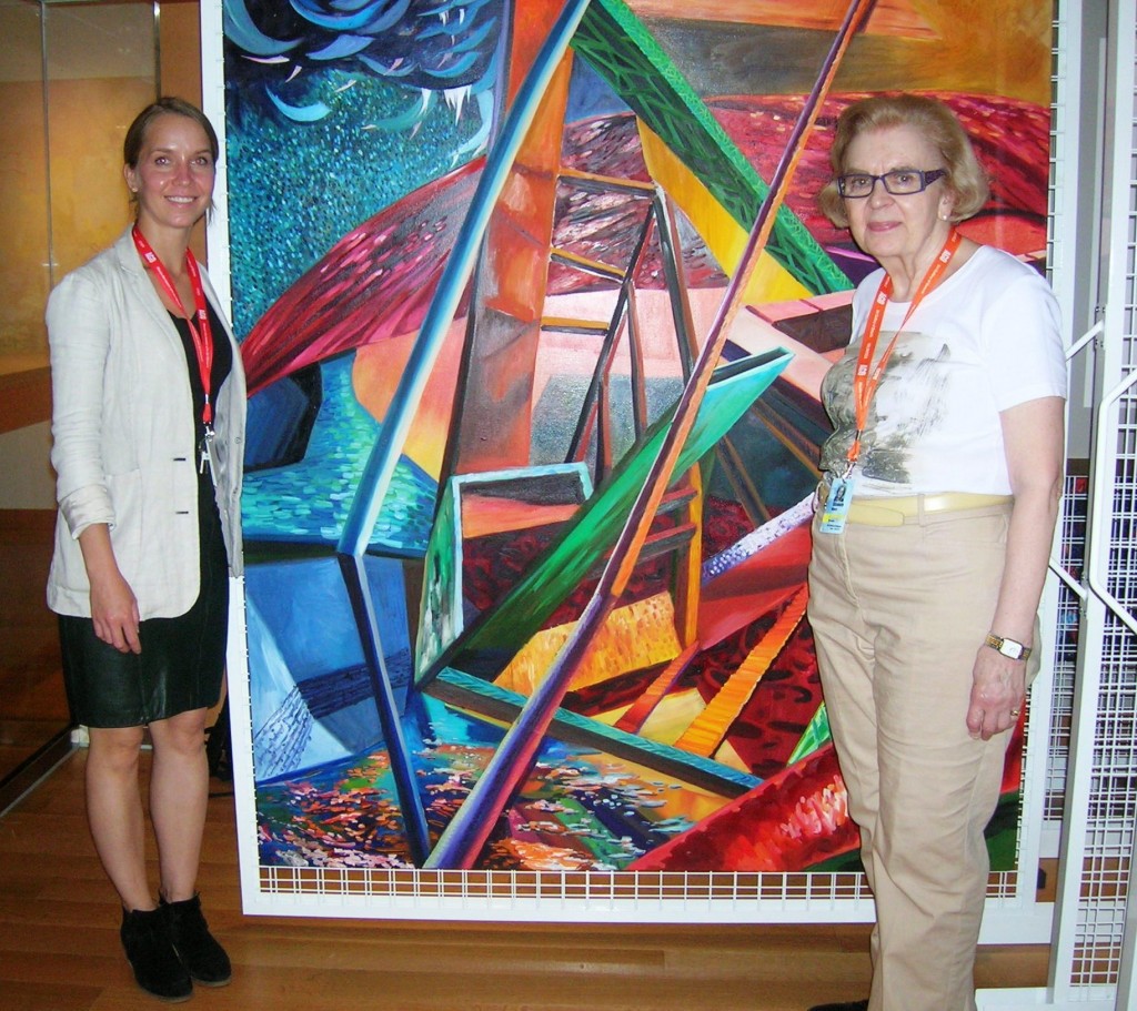 Elizabeth Petrova (L) & Betty Meyers with "Breaking Apart" by Rachel MacFarlane, courtesy Nicholas Metivier Gallery