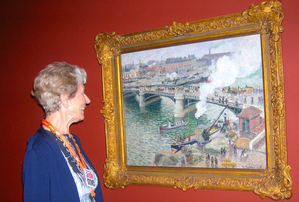 Mary Henderson with Camille Pissarro painting