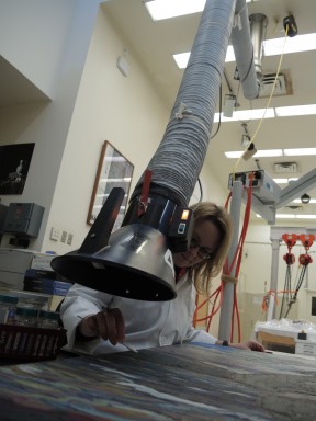 An extractor unit keeps Conservation manager Maria Sullivan safe from solvent vapours