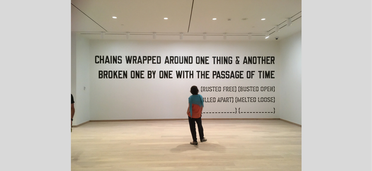 Adelina Vlas, Associate Curator of Contemporary Art, overseeing the installation of the Lawrence Weiner work. Photo by Malene Hjorngaard, who facilitated the production and installation of this monumental graphic piece.