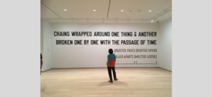 Adelina Vlas, Associate Curator of Contemporary Art, overseeing the installation of the Lawrence Weiner work. Photo by Malene Hjorngaard, who facilitated the production and installation of this monumental graphic piece.